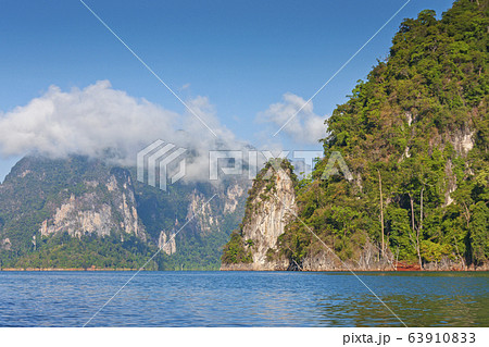 limestone Mountain and morning mist and beautiful view neture in the Cheow Lan dam Khao Sok National Park, Thailand 63910833