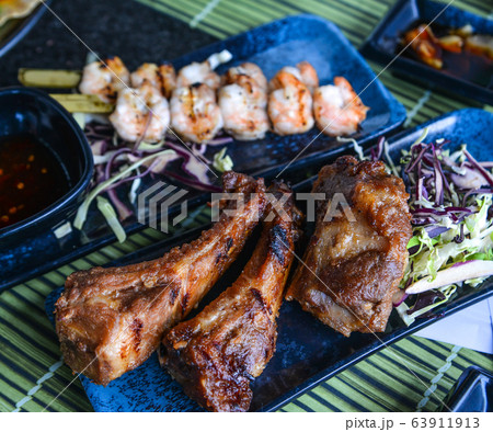 Grilled pork with salad Grilled pork with salad 63911913
