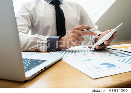business leader woman analyzing the charts and graphs for planning management new project 63914560