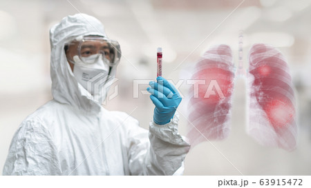 COVID-19 Coronavirus Novel corona virus epidemic lung infection disease doctor in PPE blood tube COVID-19 Coronavirus Novel corona virus epidemic lung infection disease doctor in PPE blood tube 63915472