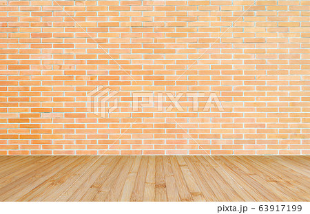 Orange-brown brick wall with wood floor in yellow brown background of interior decoration 63917199