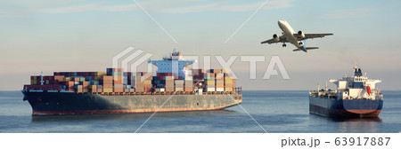 Mighty container ships in ocean at sunrise 63917887