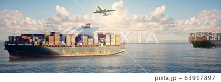 Mighty container ships in ocean at sunrise 63917897