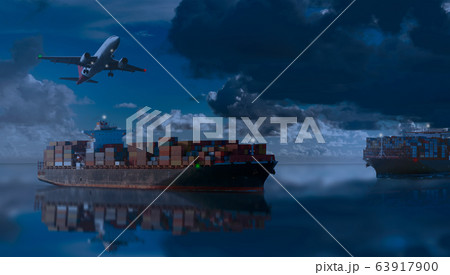 Mighty container ships in ocean at night underway 63917900