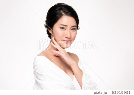 Beautiful Young Asian Woman with Clean Fresh Skin. Face care, Facial treatment, Cosmetology, beauty Beautiful Young Asian Woman with Clean Fresh Skin. Face care, Facial treatment, Cosmetology, beauty 63919931