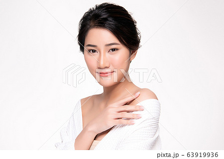 Beautiful Young Asian Woman with Clean Fresh Skin. Face care, Facial treatment, Cosmetology, beauty Beautiful Young Asian Woman with Clean Fresh Skin. Face care, Facial treatment, Cosmetology, beauty 63919936