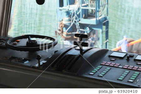 Control panel with steering wheel of a tug boat 63920410