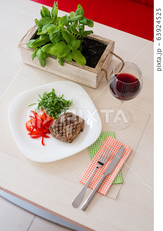 steak with vegetables and red wine in a 63924525