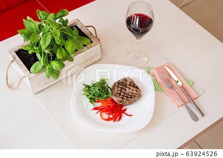steak with vegetables and red wine in a 63924526