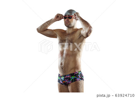 Professional male swimmer with hat and goggles in motion and action, healthy lifestyle and movement concept 63924710