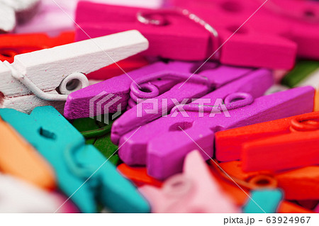 Small Clothespins of different colors close-up as 63924967
