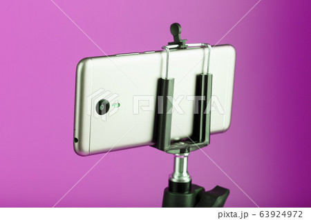 Smartphone on a tripod as a photo-video camera on 63924972