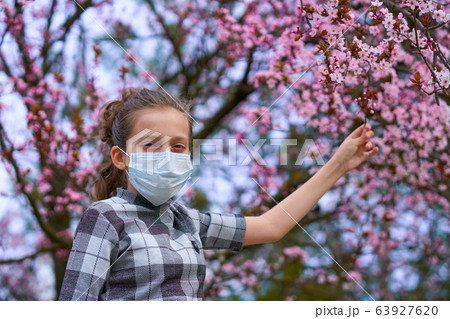 girl with a face mask is in the city outdoor, 63927620