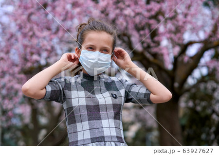 girl with a face mask is in the city outdoor, girl with a face mask is in the city outdoor, 63927627
