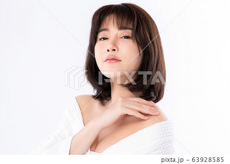 Beautiful Young Asian Woman with Clean Fresh Skin. Face care, Facial treatment, Cosmetology, beauty Beautiful Young Asian Woman with Clean Fresh Skin. Face care, Facial treatment, Cosmetology, beauty 63928585