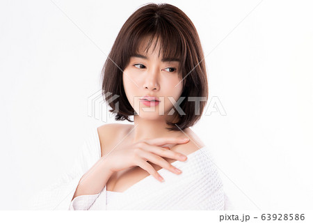Beautiful Young Asian Woman with Clean Fresh Skin. Face care, Facial treatment, Cosmetology, beauty Beautiful Young Asian Woman with Clean Fresh Skin. Face care, Facial treatment, Cosmetology, beauty 63928586