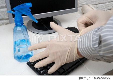 concept of cleaning or disinfecting the office - a concept of cleaning or disinfecting the office - a 63928855