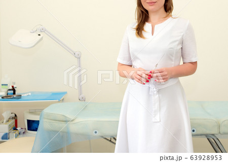Female doctor with syringe in beauty clinic. Female doctor with syringe in beauty clinic. 63928953