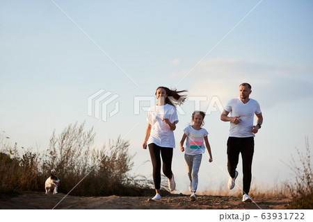 Active family spending time outside the city 63931722