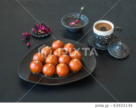 Gulab Jamun - Traditional Indian sweets on a black 63933136