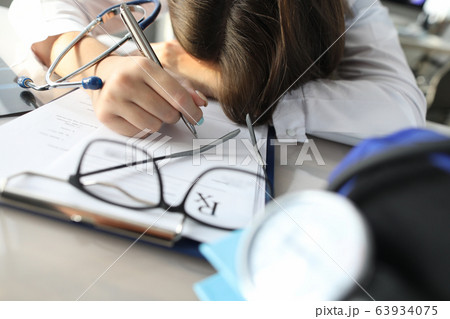 Glasses and clipboard on desktop Glasses and clipboard on desktop 63934075