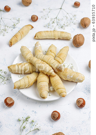 Traditional Azerbaijan holiday Novruz cookies mutaki on white plate on light background Traditional Azerbaijan holiday Novruz cookies mutaki on white plate on light background 63935710