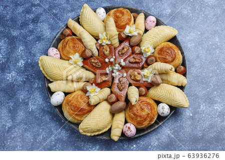 Traditional Azerbaijan holiday Novruz cookies baklavas and shakarburas on black tray plate on dark background 63936276