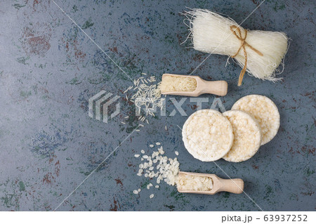 Rice flakes,rice noodles,rice bread and rice on dark background,top view 63937252