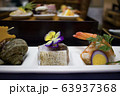 Authentic Japanese food served with floral garnish. 63937368