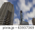 Buildings and motion blurred clouds in Kobe, Japan. 63937369