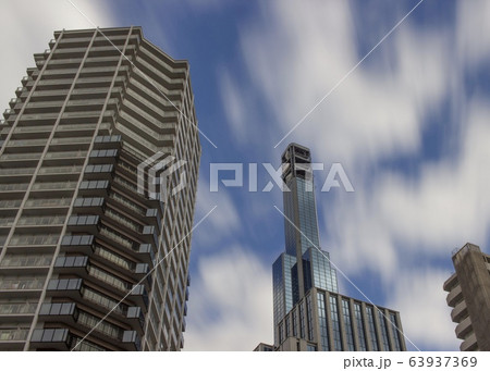 Buildings and motion blurred clouds in Kobe, Japan. 63937369