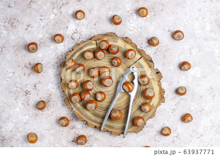 Hazelnuts on concrete background,top view Hazelnuts on concrete background,top view 63937771