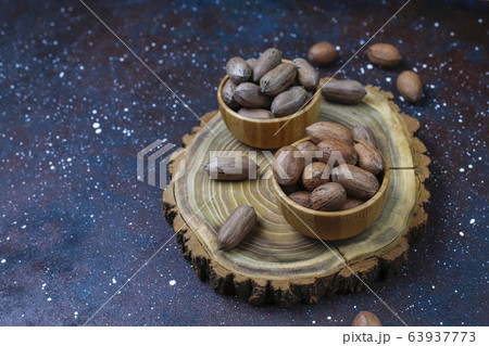 Pecan nuts on light background,top view Pecan nuts on light background,top view 63937773