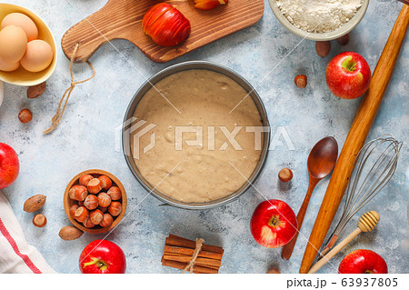 Baking concept of autumn apple pie. View from above on kitchen table. Cooking baking process with ingredients. 63937805