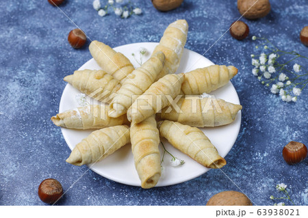 Traditional Azerbaijan holiday Novruz cookies mutaki on white plate on dark background 63938021