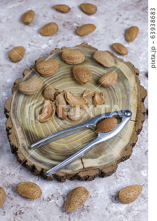 Raw fresh almonds with shell. 63938683