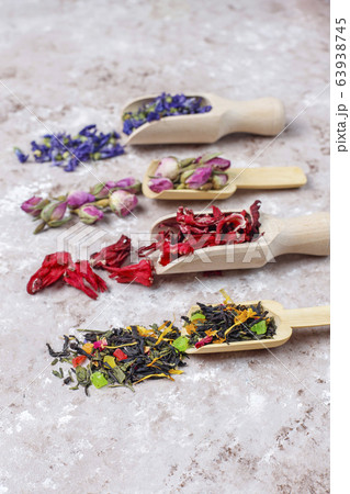 Assortment of dry tea in golden vintage mini plates.Tea types background:hibiscus,chamomile,mixed black tea,dry roses,butterfly pea tea 63938745