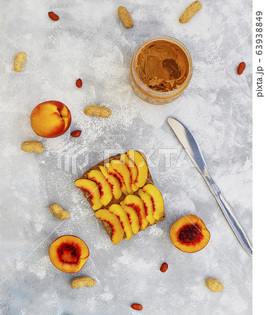 Traditional American and European summer breakfast: sandwiches of toast with peanut butter, berry,peach,fig, strawberry,raspberry, copy space top view 63938849