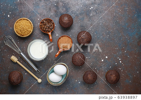 Cupcake baking background with kitchen utensils. 63938897
