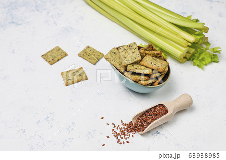 Crackers with olive oil,linen seeds and greens,top view 63938985