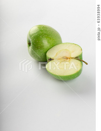 Whole and half green apple isolated on white Whole and half green apple isolated on white 63938994