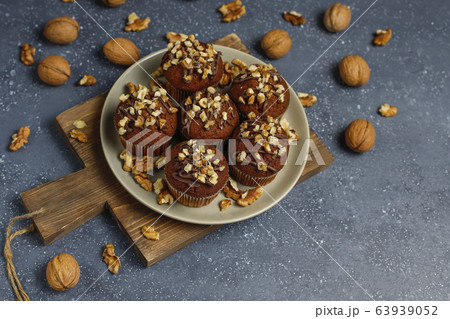 Chocolate-walnut muffins with coffee cup with walnuts on dark background ,Selective Focus. 63939052