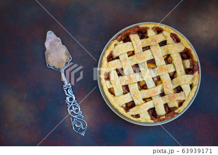 Homemade apple pie on dark background,top view,copy space Homemade apple pie on dark background,top view,copy space 63939171