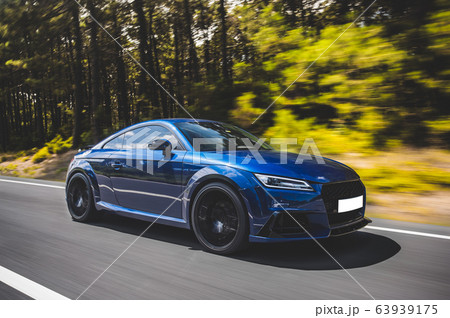 Blue luxury sedan coupe car on the highway Blue luxury sedan coupe car on the highway 63939175
