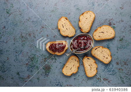 Bread slices with raspberry jam,easy healthy snack,top view 63940386