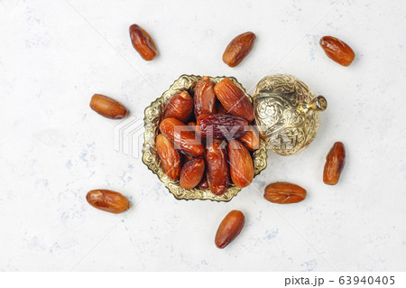 Beautiful bowl full of date fruits symbolizing Ramadan,top view 63940405