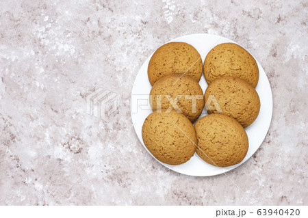 American style peanut butter cookies on light concrete background. American style peanut butter cookies on light concrete background. 63940420