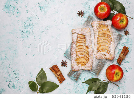 Homemade organic apple puff pastry pies with apples ready to eat,top view 63941186