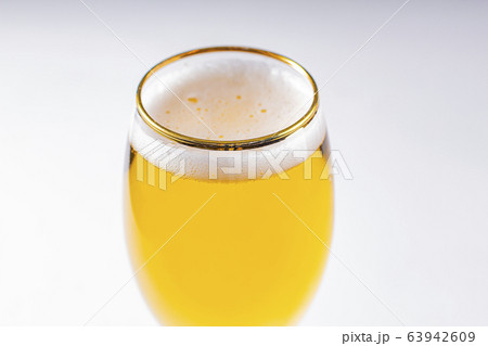 Close up of a cups of Stella Artois full of beer Close up of a cups of Stella Artois full of beer 63942609