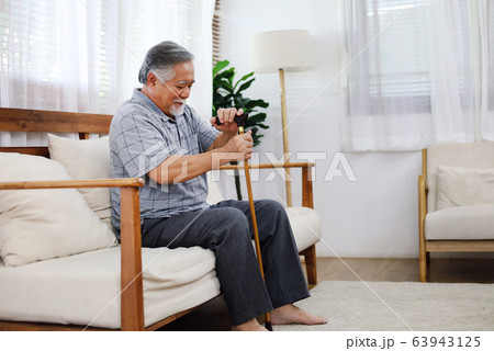 Portrait happiness senior man smile sitting alone at home. Portrait happiness senior man smile sitting alone at home. 63943125